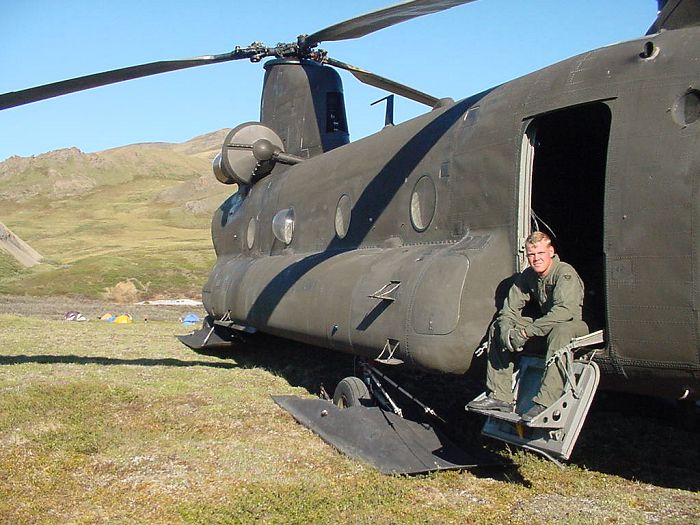 SPC Nathan Jorgensen takes a break during the Daily Inspection of Chinook 89-00176.