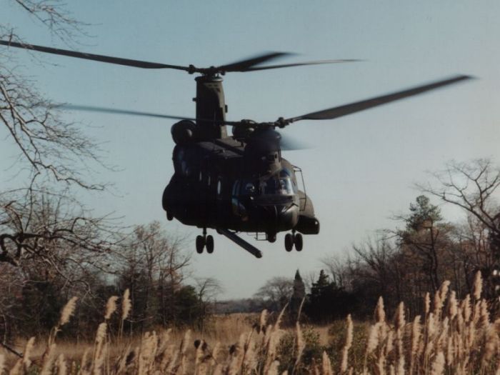 A Boeing MH-47E Chinook looking for snakes in the grass.