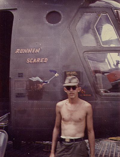 Although not assigned to the aircraft, Flight Engineer SP4 Jerry D. Redburn is pictured standing beside 65-08024 at Cu Chi before satchel charges destroyed the aircraft.