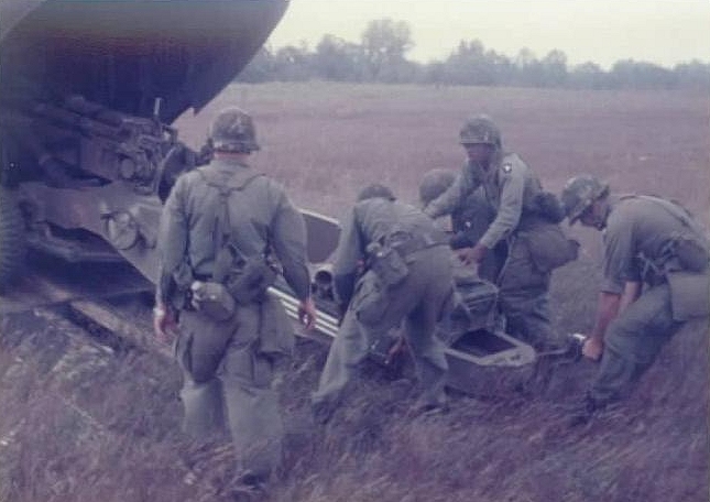 Loading a Howitzer inside CH-47B Chinook helicopter 66-19119 at Fort Campbell, Kentucky, 1978.