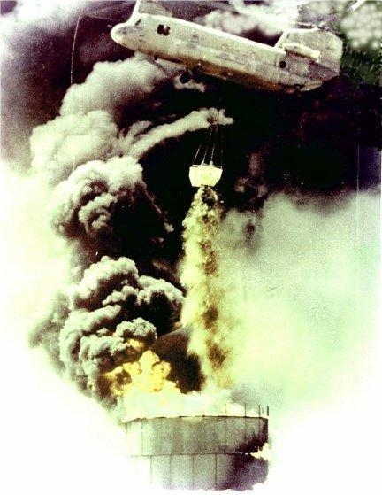 Chinook helicopter 67-18546 performing a fire bucket mission at Tae Ninh Airfield, RVN, in the fall of 1971.