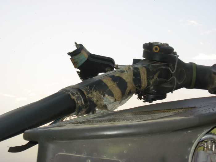 A view of the right aft end of the forward pylon of 83-24123 showing a broken blade dampner mounting bracket after it was taxied into another aircraft at Bagram, Afghanistan, on 10 August 2007.