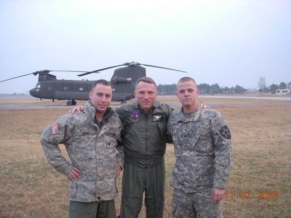 CH-47D Chinook helicopter 88-00083 at Camp Humprey, Korea, Christmas 2008. Pictured left to right, SPC Brandon Vidal, Flight Engineer, CW4 Alex Lutz, Standardization Pilot, SPC Jeremy Richard.