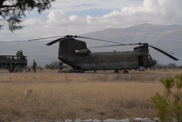 11 June 2008, PERU: U.S. Navy Seabees, construction engineers deployed from Gulfport, Mississippi, prepare equipment and luggage for transport aboard U.S. Army CH-47D Chinook helicopter 90-00208 (unit unknown) on tempoary duty in Los Cabitos, Peru and assigned to Task Force New Horizons.