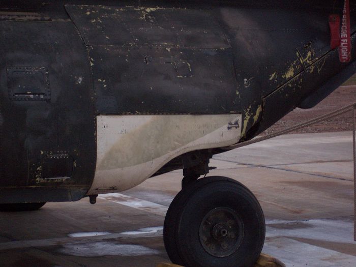 90-00224 - parked at Balad, Iraq - showing the aft landing gear repairs that were made utilizing parts from 90-00212 and a wrecked Iranian Chinook.