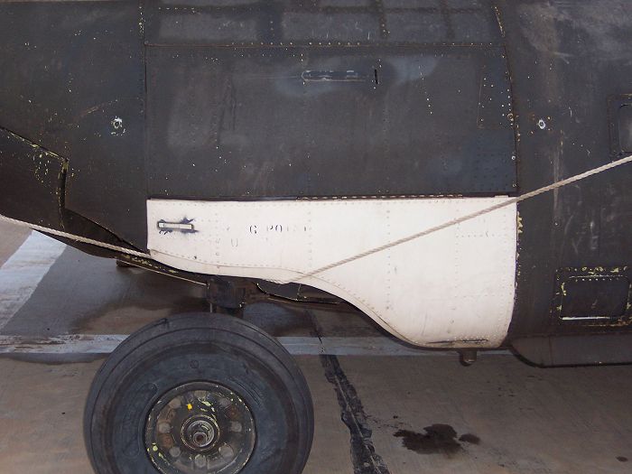 90-00224 - parked at Balad, Iraq - showing the aft landing gear repairs that were made utilizing parts from 90-00212 and a wrecked Iranian Chinook.