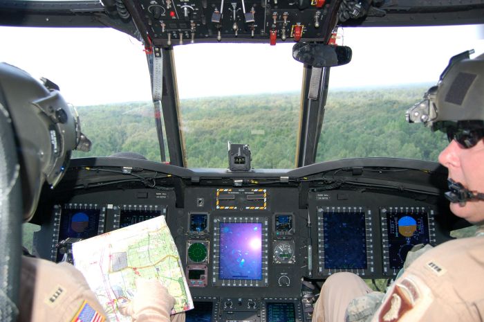 Chief Warrant Officer 4 David Watson, standardization instructor pilot, and Chief Warrant Officer 4 Tom Miskowiec, standardization instructor pilot and instrument flight examiner, both with 7th Battalion, 101st Aviation Regiment, 101st Airborne Division, fly a new CH-47F.