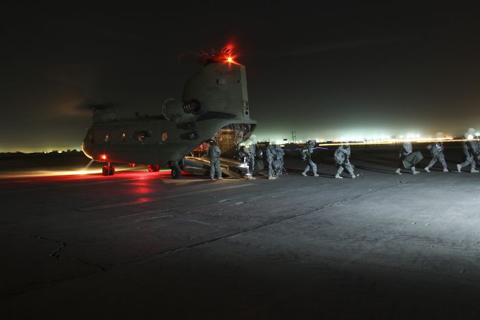 20 May 2009. CAMP TAJI, Iraq: Under the cover of night, Soldiers from the 1st Air Cavalry Brigade, 1st Cavalry Division, Multi-National Division - Baghdad, arrive at Camp Taji, Iraq for their year-long deployment in support of Operation Iraqi Freedom. Soldiers flew in on a CH-47F Chinook helicopter assigned to Company B, 2nd Battalion, 4th Aviation Regiment, Combat Aviation Brigade, 4th Infantry Division, home stationed at Fort Hood, Texas.