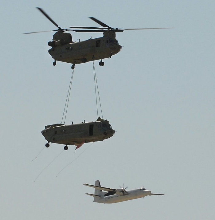 CH-47F Chinook helicopter 08-08057 gets a lift as a sling load from Kunduz, Afghanistan to Mazar-e-sharif for a load out on a C-5 back to Corpus Christi Army Depot (CCAD), Texas, after a hard landing on 19 July 2011 ripped the landing gear from the airframe.