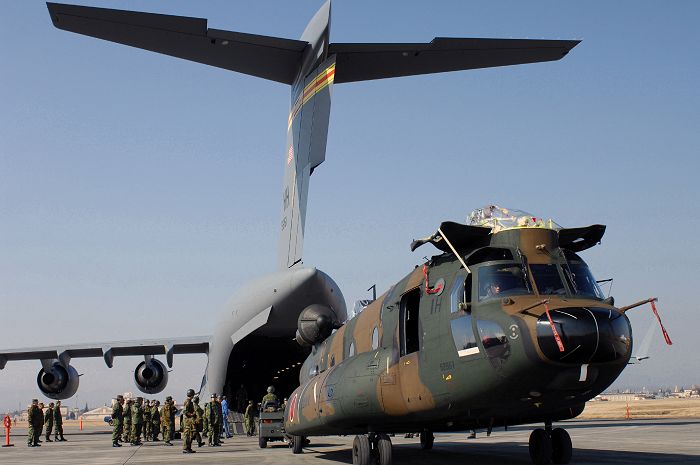 CH-47J Chinook helicopters practice strategic air movement by C-17 aircraft.