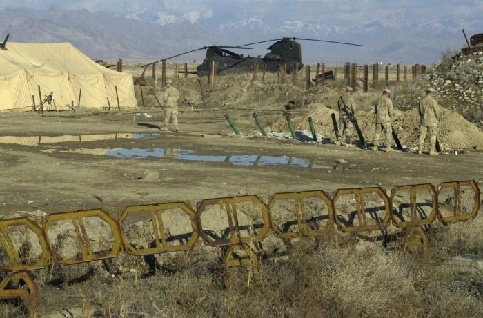 An MH-47E awaiting its next mission in Afghanistan, circa March 2002.